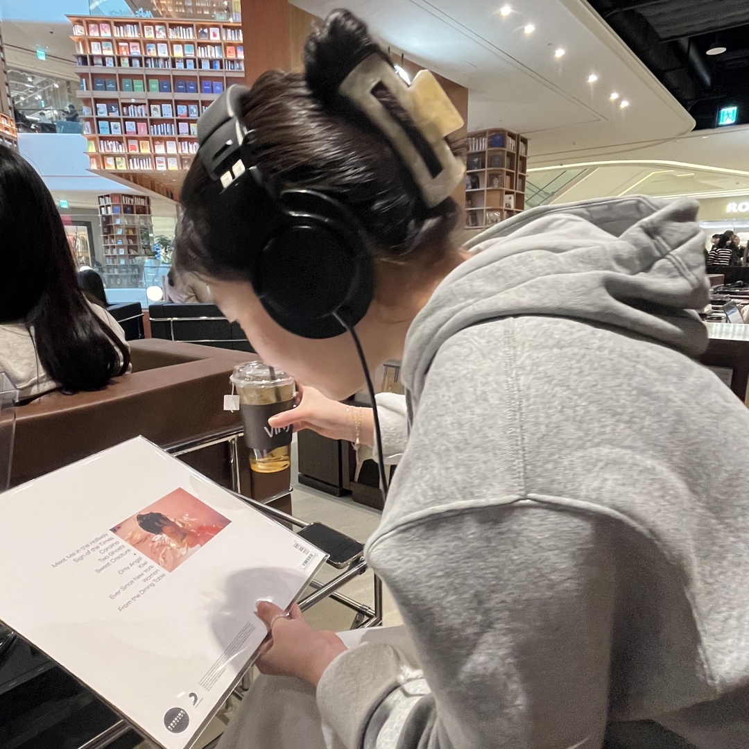 Sooim listening to music with headphones on